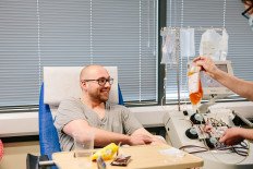 One of the Britain's first recovered COVID-19 patients, Adam Drew, donates convalescent plasma by plasmapheresis, to help with treatment of the coronavirus disease (COVID-19) cases, at Tooting Blood Donor Centre, in Tooting, London, Britain, on April 25, 2020. 