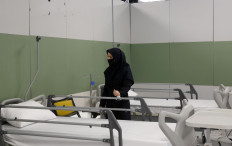 An Iranian health inspector checks a makeshift hospital set up inside the Iran Mall, northwest of Tehran, on March 21, 2020 amid the coronavirus outbreak. 