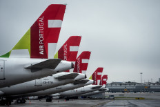 TAP airline aircrafts remain on the tarmac of the Humberto Delgado airport in Lisbon on April 9, 2020. 