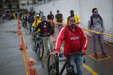 Employees of the Amarilo construction company stand within the marks of social distancing, amid the coronavirus disease (COVID-19) outbreak in Bogota, Colombia May 19, 2020. 