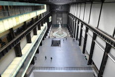 A picture shows a near-empty Turbine Hall at the Tate Modern in London on March 17, 2020 after the UK government announced stricter measures and social distancing advice to deal with the novel coronavirus outbreak. 
