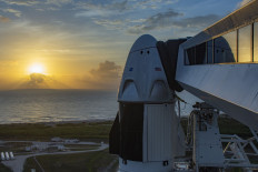 This handout image released by SpaceX and taken on May 24, 2020 shows a SpaceX Falcon 9 rocket with the company's Crew Dragon spacecraft onboard on the launch pad at NASA's Kennedy Space Center in Florida. Gray skies loomed over Florida's Atlantic coast on May 26, just one day before two astronauts were set to blast off aboard a SpaceX capsule on the most dangerous and prestigious mission NASA has ever entrusted to a private company.