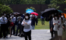 South Korea limits school numbers over virus spike  			