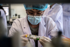 A worker is seen inside the Beijing Applied Biological Technologies (XABT) research and development laboratory in Beijing on May 14, 2020. 