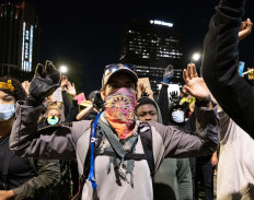 Burned flags and curfews: US cities convulsed by unrest 			