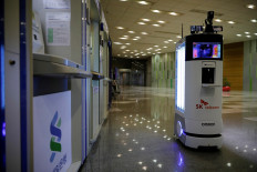 Armed with disinfectant and admonishments, South Korean robot fights coronavirus spread
