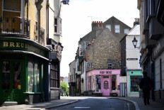 A general view shows a largely deserted street in Margate south east England, on May 16, 2020, following an easing of lockdown rules in England during the novel coronavirus COVID-19 pandemic. 
