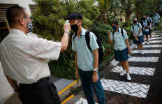 Schools reopen as Singapore eases lockdown restrictions