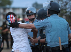 A demonstrator is arressted during a protest against police brutality and the death of George Floyd, on May 31, 2020 in Minneapolis, Minnesota. Protests continue to be held in cities throughout the country over the death of George Floyd, a black man who died while in police custody in Minneapolis on May 25. AFP/Getty Images/Scott Olson