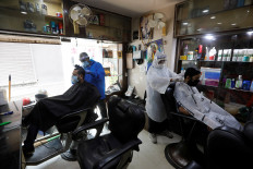 India reopens more public spaces despite record virus infections