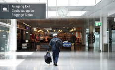 A police officer walks through a terminal of the German airline Lufthansa at the Franz-Josef-Strauss airport in Munich, southern Germany, on June 3, 2020.Germany came under pressure on Monday to introduce mandatory coronavirus testing for holidaymakers returning from high-risk countries to prevent driving up infections in Europe's largest economy.
