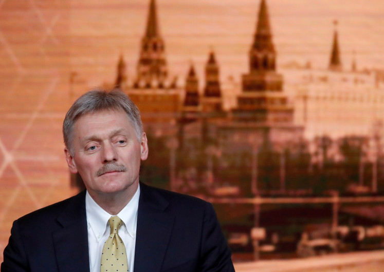 Kremlin spokesman Dmitry Peskov listens during Russian President Vladimir Putin's annual end-of-year news conference in Moscow, Russia, on December 19, 2019. 
