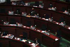 Hong Kong passes China national anthem bill amid protests by democracy lawmakers