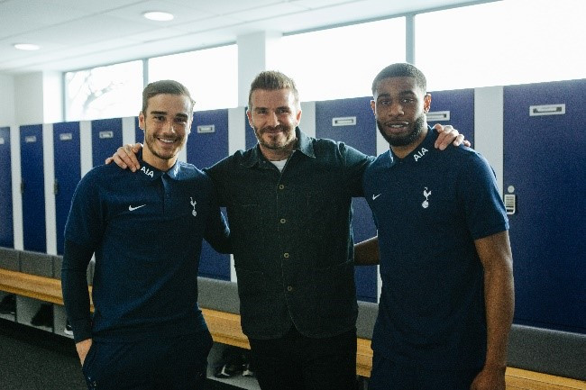 Beckham poses for a picture with Tottenham Hotspurs players.