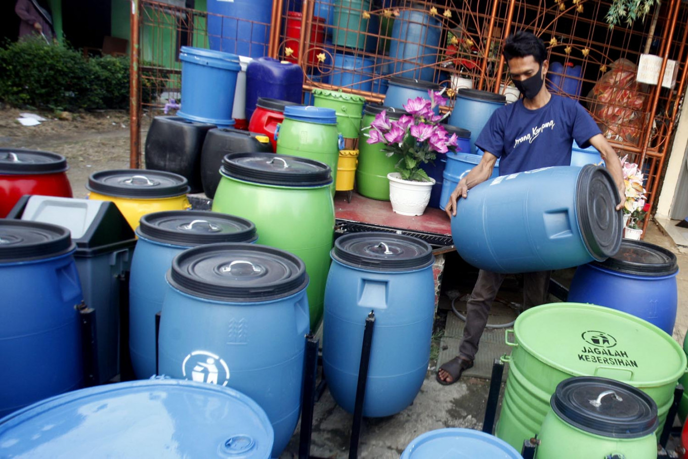 A man arranges waste bins made of recycled materials in Cibinong, Bogor, West Java, on June 5. TikTok’s owner, Beijing-based ByteDance, plans to take a US$100 million loss this year to provide free advertising credits to SMEs worldwide willing to try the platform’s new services.