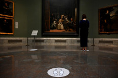 A woman stands in front of the painting 'Las Meninas' by Spanish painter Diego Velazquez at the Prado Museum on June 4, 2020 in Madrid, amid the coronavirus disease (COVID-19) outbreak. 