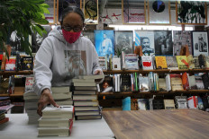 Blanche Richardson, who runs Marcus Books, an independent bookstore that has served the black community in the Bay Area with books by and about African Americans for the past 60 years, organizes books from a recent shipment, in Oakland, California, US June 5, 2020. 