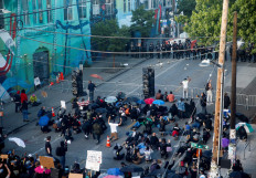 Man drives car into Seattle protest crowd, shoots bystander: Police