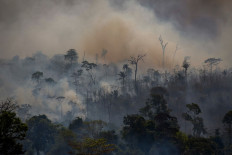 Up in smoke: Thick smoke rises from forest fires in Altamira, Para state, Brazil, in the Amazon basin, on Aug.
27, 2019. Experts say the COVID-19 pandemic has given the world a golden opportunity to entrench
environmental protection and restoration. 