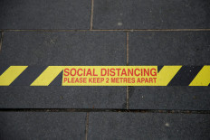 Britain reviews distancing rule for next stage of easing lockdown