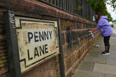 Signs at Beatles pilgrimage site defaced in racism row