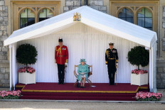 Queen marks official birthday with scaled-back parade at Windsor