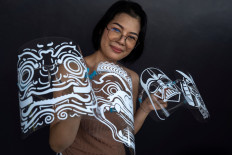 Thai mom's face shields protect against virus and villains