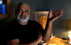 Writer Khaled Khalifa speaks during an interview with AFP at his home in the Syrian capital Damascus on June 2, 2020. 