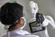 Robots: Allies during virus crisis, enemies later?