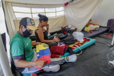 Economic carnage forecast as virus cases surge in Americas