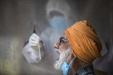 Some countries using virus curbs to 'silence critics', ex-leaders warn