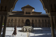 Tourists visit the Court of the Lions (Patio de los Leones) at the Alhambra in Granada on June 17, 2020, on the day it reopens to the public after three months of closure due to the coronavirus pandemic.
