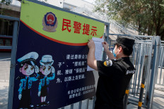 Beijing residents rush coronavirus test clinics as emergency rules expand