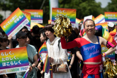 People attend the annual Tokyo Rainbow Parade in Tokyo, on May 6, 2018, to show support for members of the LGBT community.
