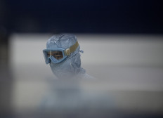 This photo taken on June 9, 2020 shows a laboratory researcher working at a lab at the Yisheng Biopharma company, where researchers are trying to develop a vaccine for the COVID-19 coronavirus, in Shenyang, in China's northeast Liaoning province.