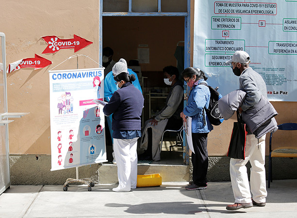 People arrive at a triage area at the General Hospital to be tested for the coronavirus disease (COVID-19), in La Paz, Bolivia June 23, 2020. 