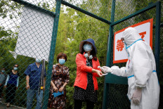 Beijing officials declare outbreak 'under control'