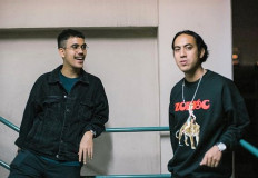 Worth more: Randy Danistha (right) and Nara Anindyaguna, his younger brother and Random Brothers bandmate pose in a stairwell. Randy says that most musicians  received only a fraction of their income from royalties. 