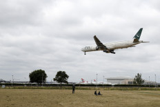 A Pakistan International Airlines Boeing 777 comes in to land at Heathrow airport in west London as the UK government's planned 14-day quarantine for international arrivals to limit the spread of Covid-19 starts on June 8, 2020.