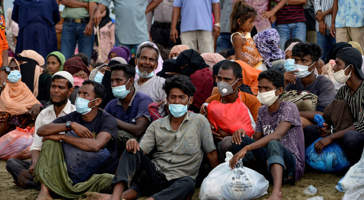 Rohingya stranded off Indonesia undergo COVID testing, given shelter