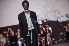 A model presents a creation for fashion house Etro during the presentation of its men's spring/summer 2020 fashion collection in Milan on June 16, 2019. 