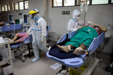 Philippines keeps partial restrictions in the capital to fight virus