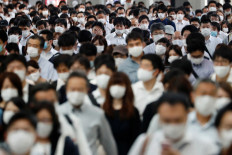 Tokyo declares coronavirus red alert as situation 'rather severe'