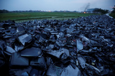 Broken TV and computer screens are seen at a garbage dump near a rice field in Vinh Phuc province, Vietnam, July 1, 2020. Picture taken July 1, 2020.Humans discarded more than 50 million tons of electronic waste last year -- an increase of 20 percent in just five years -- making tech refuse the world's fastest growing waste problem, the United Nations said Thursday.