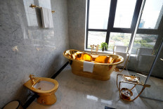 A gold plated bathtub and a gold plated toilet are seen in the newly-inaugurated Dolce Hanoi Golden Lake luxury hotel, after the government eased a nationwide lockdown following the global outbreak of the coronavirus disease (COVID-19), in Hanoi, Vietnam, on July 2, 2020. 