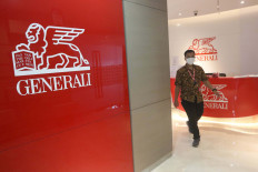 An employee works at the office of Asuransi Jiwa Generali Indonesia in Jakarta on July 2, 2020.