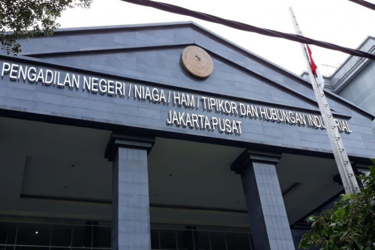 The Central Jakarta District Court building in Jakarta. The pressure is on President Joko "Jokowi" Widodo to set the record straight on the court's ruling that effectively requires the General Elections Commission (KPU) to postpone the 2024 polls.
