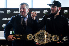 Mixed martial arts (MMA) fighter Khabib Nurmagomedov and and his father Abdulmanap Nurmagomedov give a press conference in Moscow on November 26, 2018.
