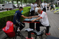 Beijing lifts most travel restrictions, says city's outbreak contained