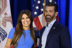 In this file photo taken on Feb. 3 2020 Donald Trump Jr. (right) and his girlfriend Kimberly Guilfoyle smile during an event held by the White House.